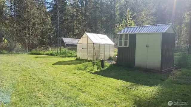 The well head is near the chicken coop and greenhouse.