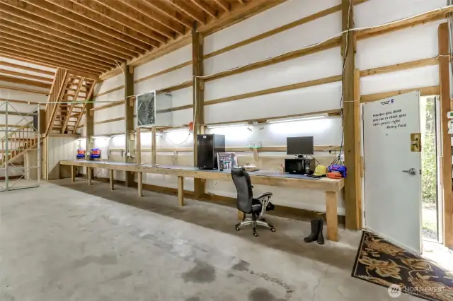 Tons of lighting-several ceiling fans and there is heating and ventilation.  The staircase to the loft office is shown on the left.