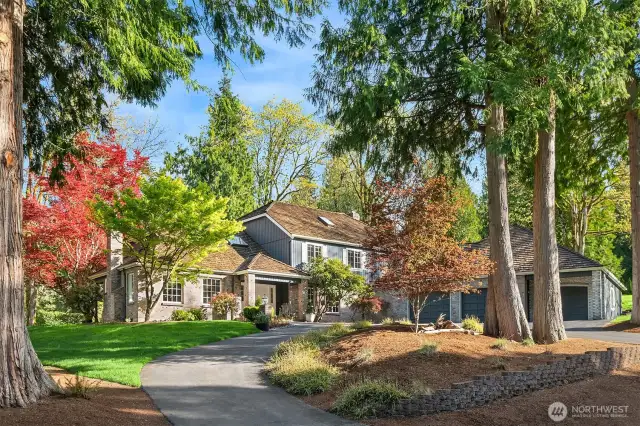 A storybook setting ~ Sited majestically on a quiet, peaceful cul-de-sac, this beautiful home is completely remodeled with no expense spared, and features an addition of living square footage and an expanded 1,485 square foot garage.
