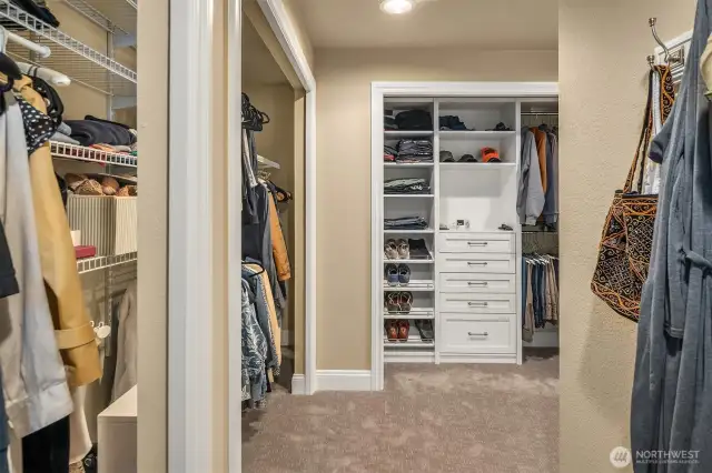 The lavish primary suite overlooks the back yard through plantation shutters.  Adjacent is the circular 5-piece en suite bathroom with heated floors, jetted tub and a large walk-in closet.