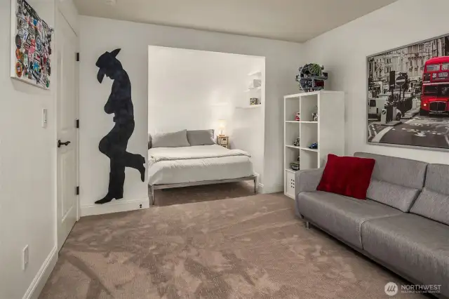 All the secondary bedrooms are large.  Bedroom number 2 features a unique cove, where in this setup, the Homeowner has situated the bed, providing plenty of space for a couch to provide casual space to bedroom.