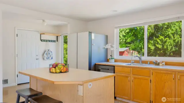 That kitchen island you’ve been dreaming about? It’s right here, ready for meal prep, baking marathons, or morning coffee chats. A large window over the sink frames a clear view of the backyard, so you can stay connected to the action outside while getting things done inside.