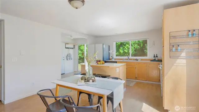 The dining area is perfectly positioned just off the kitchen, creating a seamless flow for everyday meals or casual gatherings. With natural light spilling in and sightlines to both the living space and backyard, it’s a spot that feels both connected and comfortable.