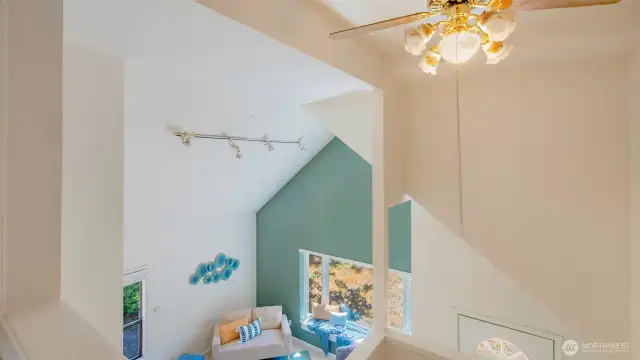 Pause at the top of the stairs and take it all in - the view looking down shows off the kind of detail that sets this home apart. It’s not your everyday layout, and that’s exactly what makes it feel so special.