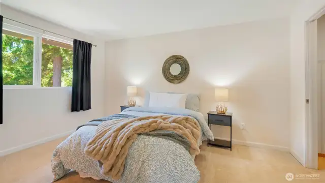 This primary bedroom brings the space and then some - room for a king bed, or cozy reading nook, or even a little yoga corner if that’s your vibe. And just to the right, the walk-in closet is spacious enough to keep everything organized and out of sight.