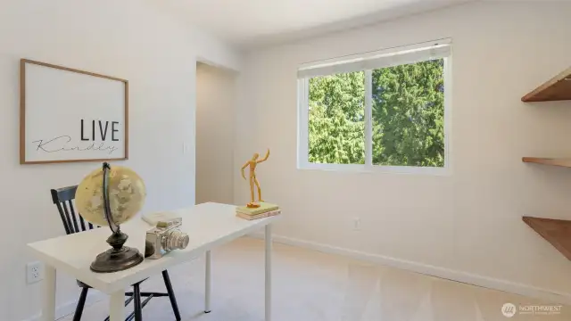 Bedroom two comes with a backyard view and a full wall of built-in shelving - perfect for books, plants, LEGO masterpieces, or whatever deserves a spot on display.