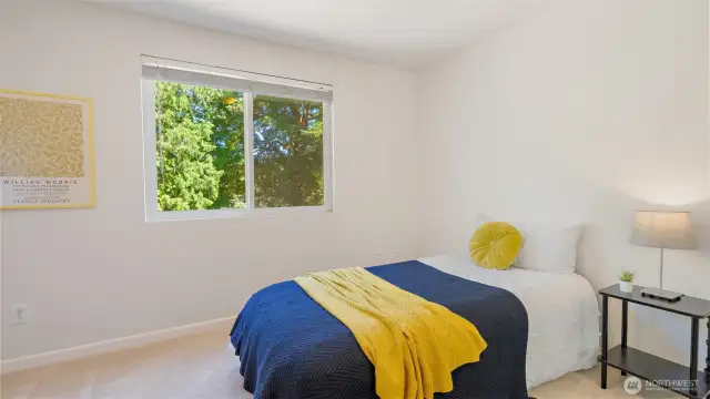 Bedroom three also enjoys a peaceful backyard view - perfect for daydreaming, studying, or just soaking in a little sunshine.