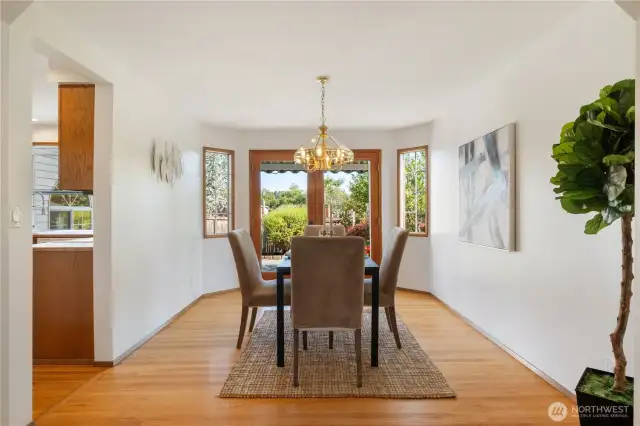Beautiful wood french doors off the dining room lead to additional entertaining area.