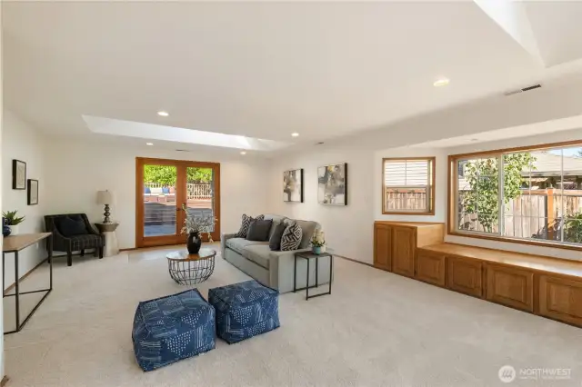 Spacious rec room with skylights, french doors and large windows allowing tons of light!