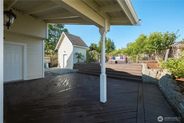 Partially covered deck area accessed through French doors in rec room.
