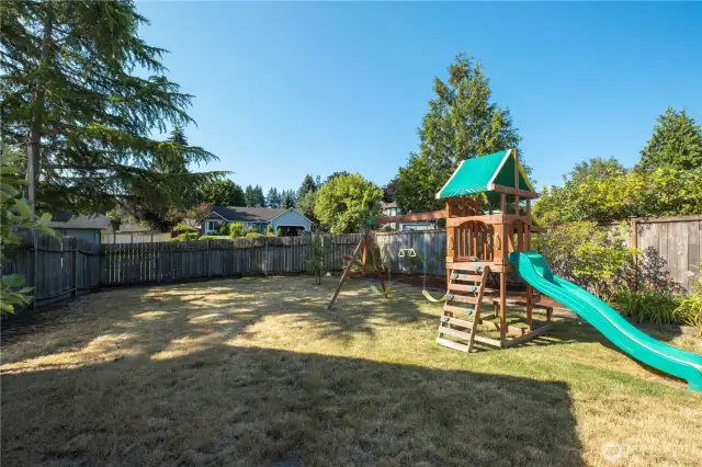 View of fenced-in yard from the entry gate.
