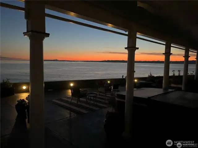 Picturesque sunset with the Marine lights glowing in the seawall for a picture perfect evening on the patio.