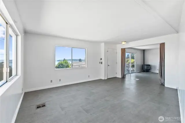 Living Room view to family room including pellet stove