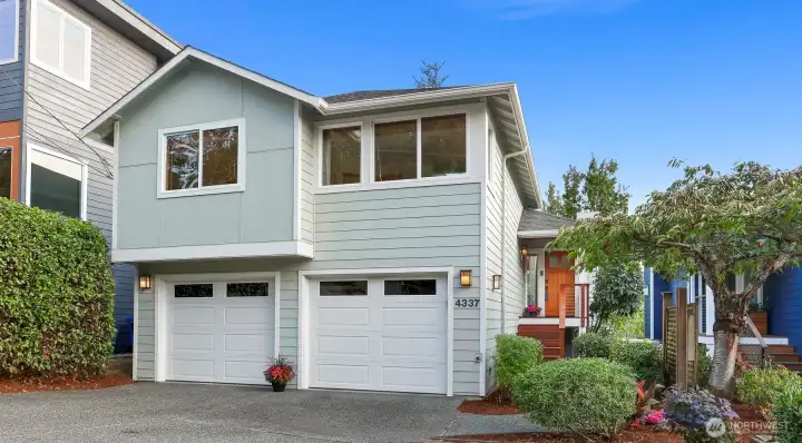 This beautiful contemporary home has undergone several recent exterior upgrades including all new durable Hardie Plank siding and exterior paint.  Attractive newer front porch, steps and front door. The lot has lovely established landscaping too!