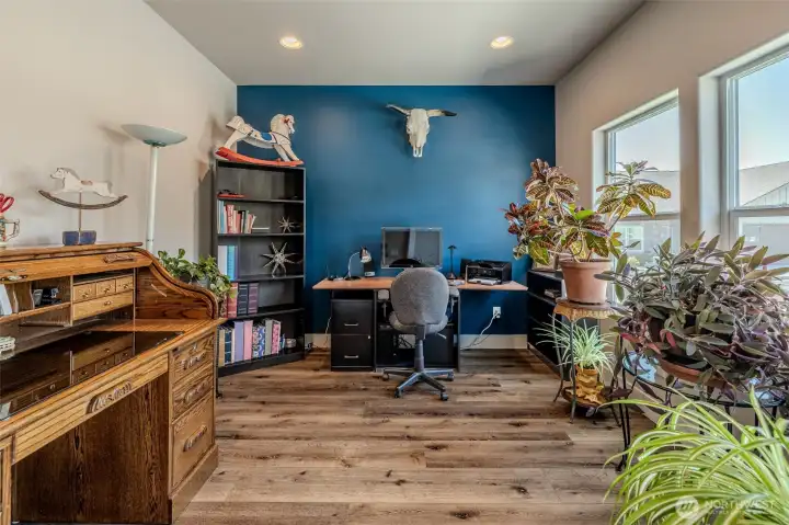 Office/den just off entry with large windows