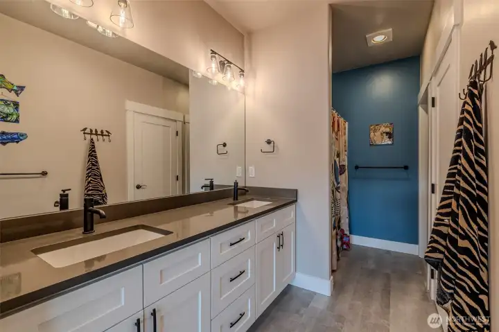 Primary bath with double sinks and walk-in shower