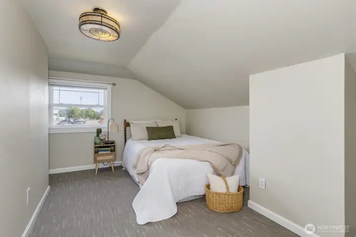 Upstairs bedroom #2, large with a wonderful nook perfect for a creative workspace.
