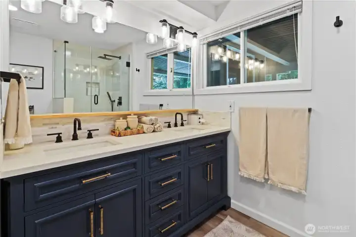 Downstairs remodeled bathroom with double sink and shower