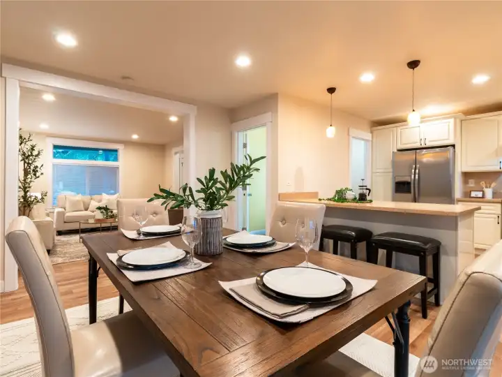 Well appointed dining room, just beyond the living room, open to the kitchen allows a chef-to-table like experience for you and your guests!