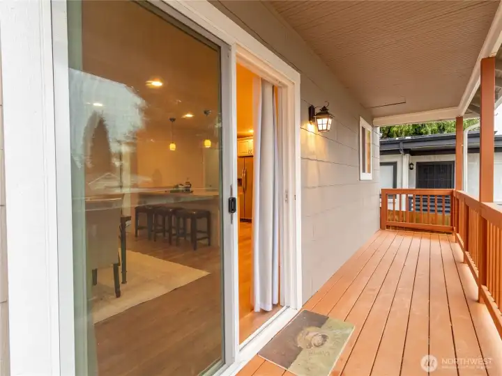 Freshly stained back porch, modern lighting sets the tone for a relaxing space to unwind!