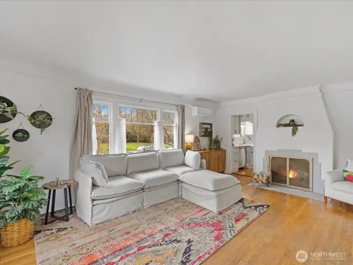 The living room offers hardwood floors & timeless architecture