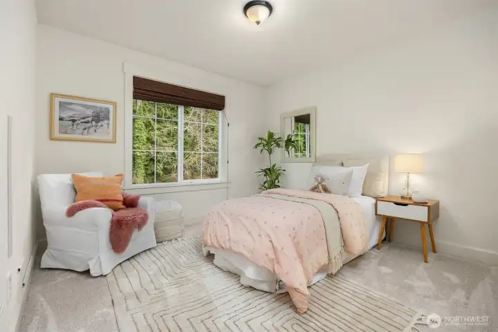 Comfortable guest bedroom offering flexible use and natural light with brand new carpeting.