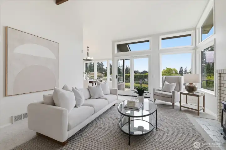 Vaulted ceilings and expansive windows fill the space with natural light