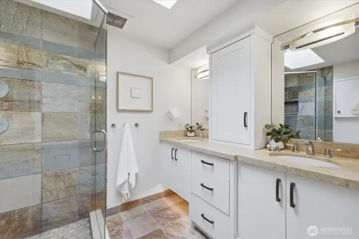 Primary ensuite bath with heated floors & built-in cabinetry