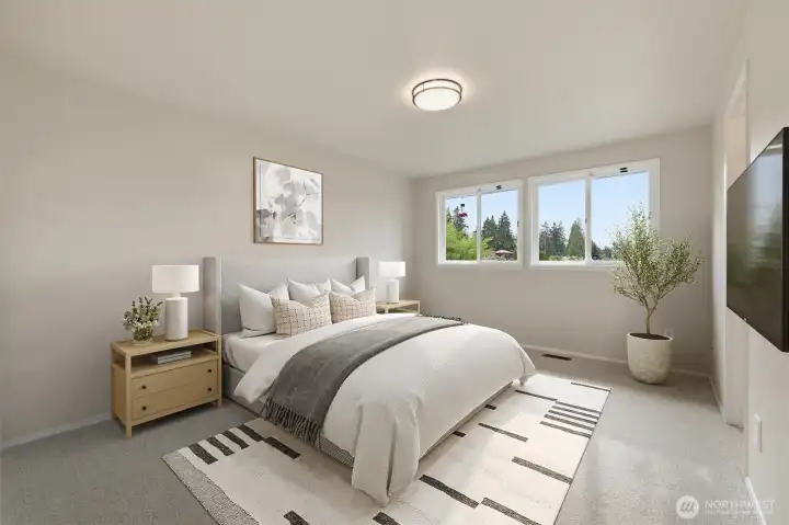 Second bedroom with ensuite bath and walk-in closet for added comfort and flexibility (virtually staged)