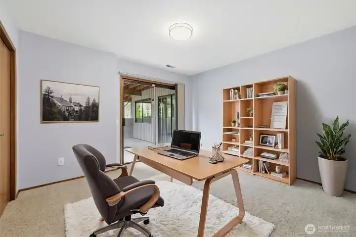 Lower level bedroom as home office (virtually staged)