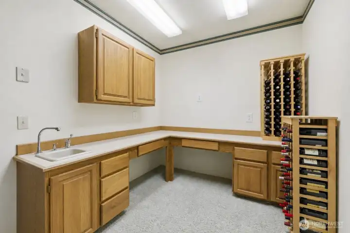 Lower-Level Bonus Room: Flexible space shown as wine storage with kitchenette