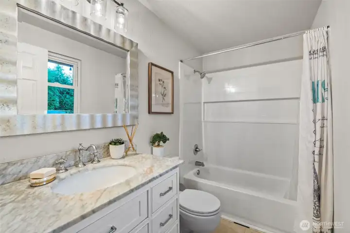 Modern ensuite bath with thoughtful updates.