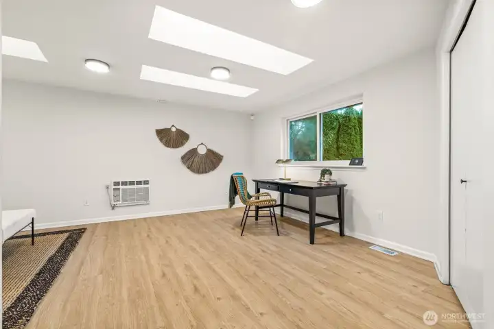 Another perspective of Bedroom #2, currently styled as a bright and functional home office.