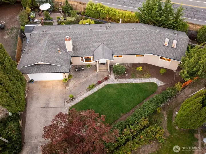 Aerial perspective highlighting the full property and peaceful setting.