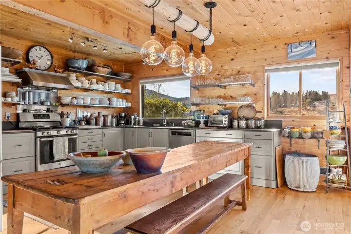 Open shelving, high-end appliances, and natural light help create a peaceful kitchen.