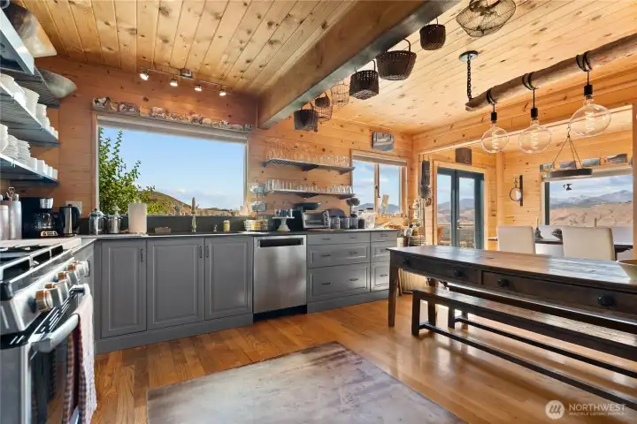 South-facing kitchen windows allow for a wonderful view while doing the dishes.  Spacious, calming and cozy.