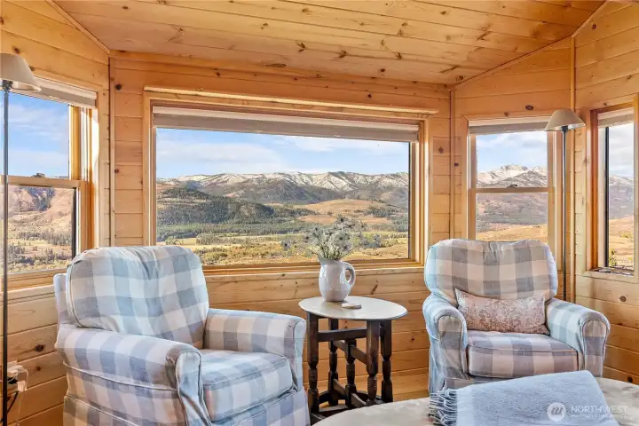 Settle in with a book and feel the cozy warmth of this lovely home...all the while sneaking glimpses of the Methow Valley floor below.