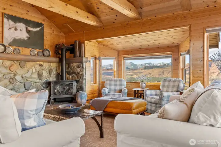 Natural river rock surrounds the propane stove, creating a true mountain aesthetic.