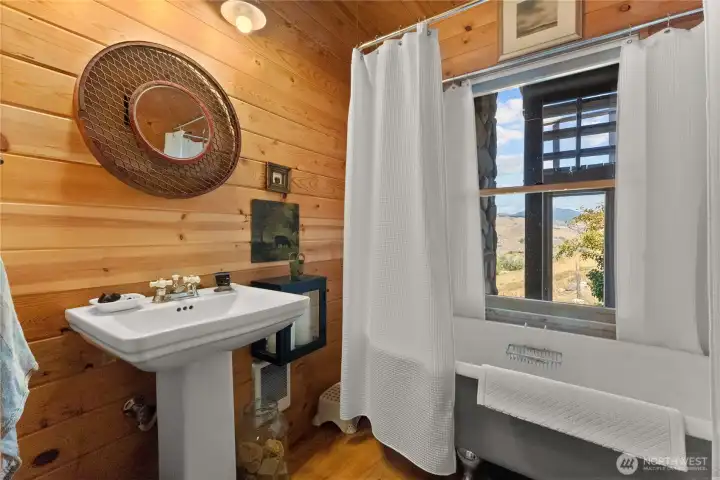 Main floor bathroom with clawfoot tub.