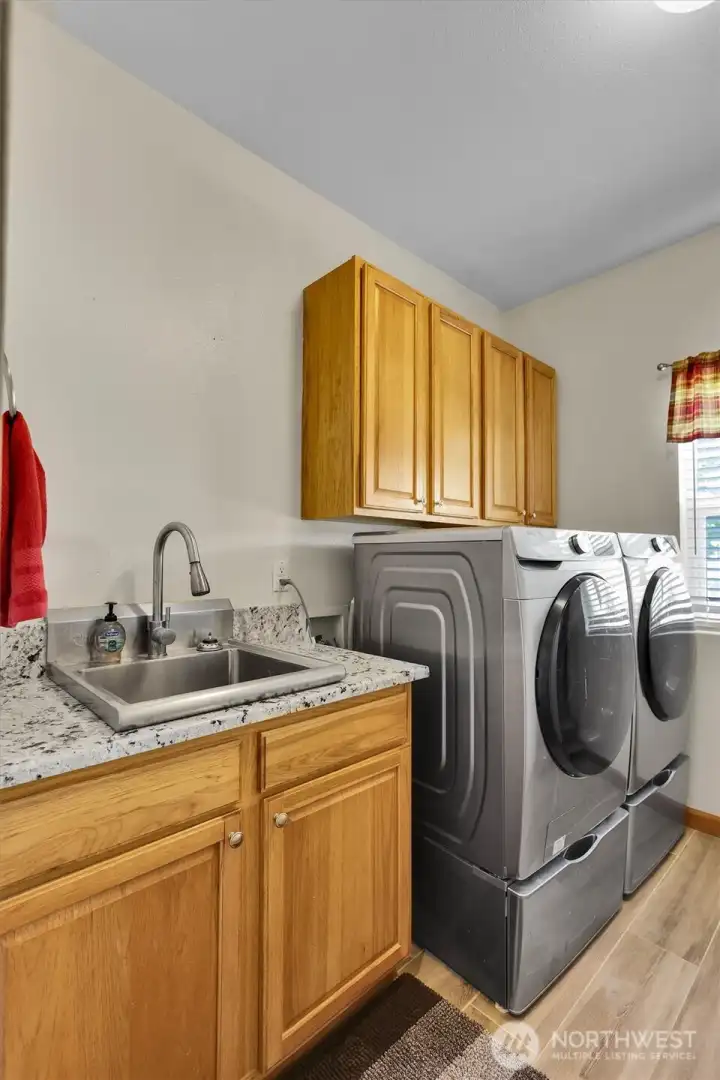 Laundry room with cabinets