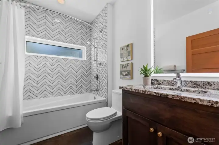 Guest Bathroom with custom tile and lighted mirror