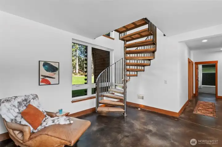 spiral custom stairs that lead you up to the loft with wetbar which could be an extra room