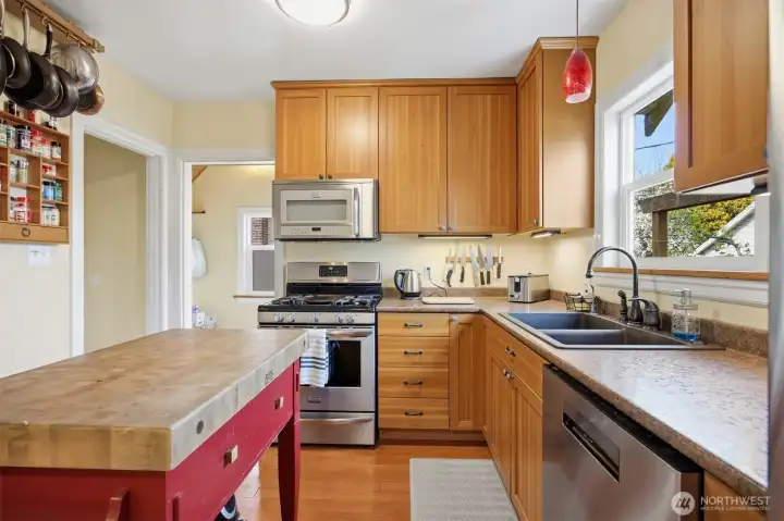 The kitchen has beautiful shaker-style fir cabinets with a lot of storage space.