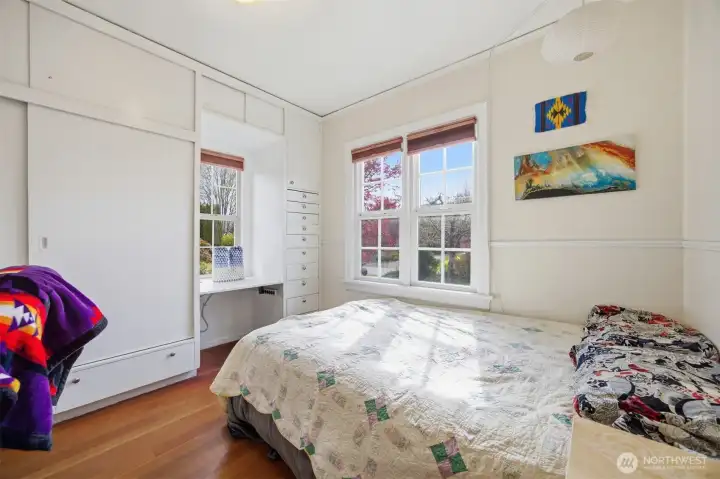 The 2nd bedroom has a wall of built-in closets and storage.