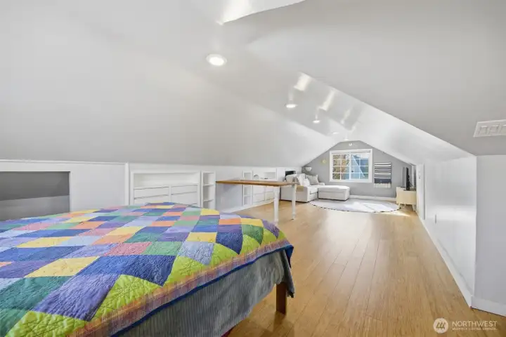 The entire upper floor is a large bedroom and television area, currently.