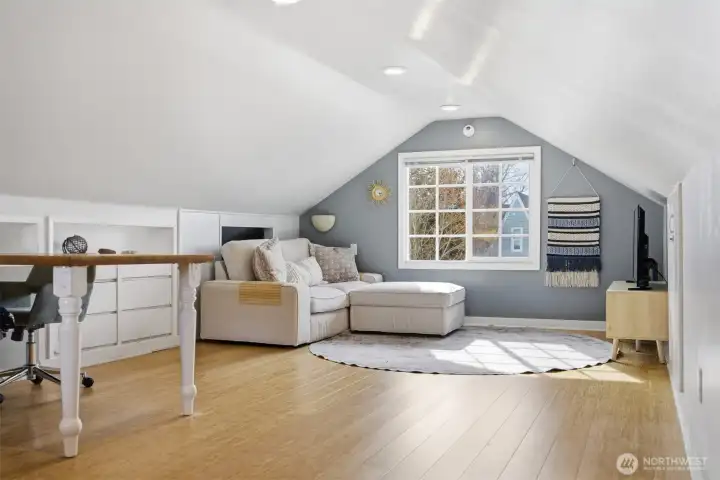 There are built-ins near the television end of the upper floor.