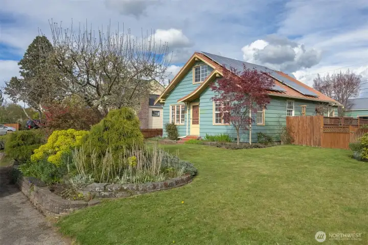 Looking at this beautiful home with its solar panels that are adequate for these homeowners to pat just about $8 per month all year.