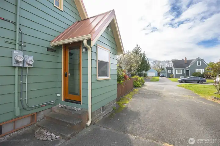 There is a shared driveway off of Victor St and there is also parking off of the alley.