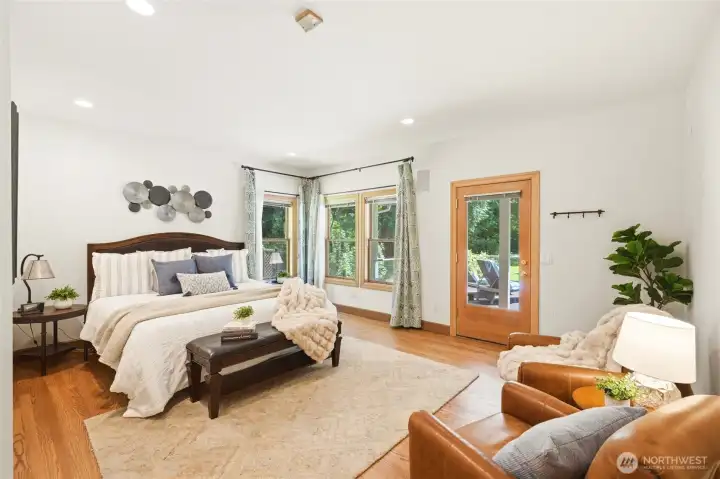 The spacious rimary bedroom is on the main floor with its own entrance to the 1400 Square Foot deck! The spacious rimary bedroom is on the main floor with its own entrance to the 1400 Square Foot deck!