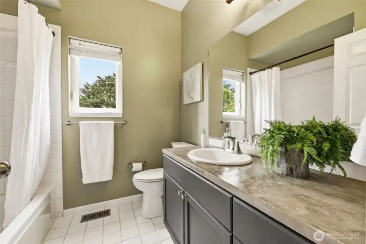 Updated full bath on the upper level servicing the other two bedrooms.